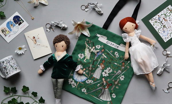 Giselle ballet tote bag, dolls, greeting cards, mug, print and keyrings on a grey background