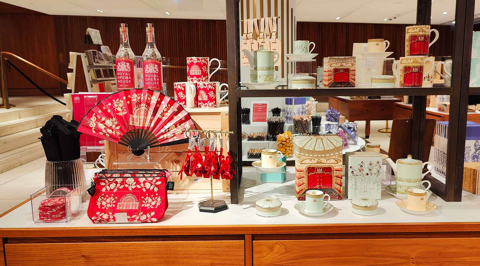 A collection of products arranged on a wooden display cabinet.