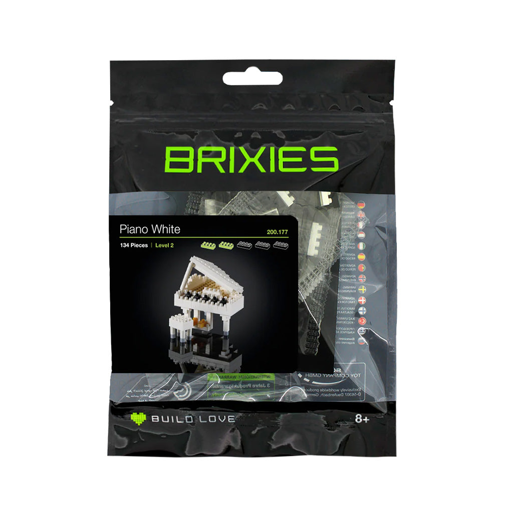 BRIXIES white piano white building block set packaging on a white background
