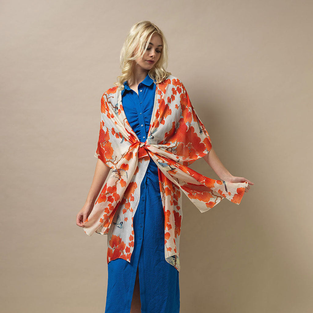 close up of model wearing Acer Red Throwover in blue dress