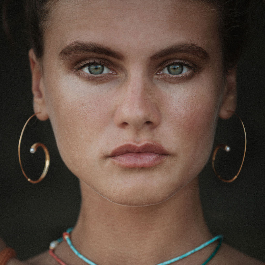 headshot of model wearing Avalon Pearl Earrings 