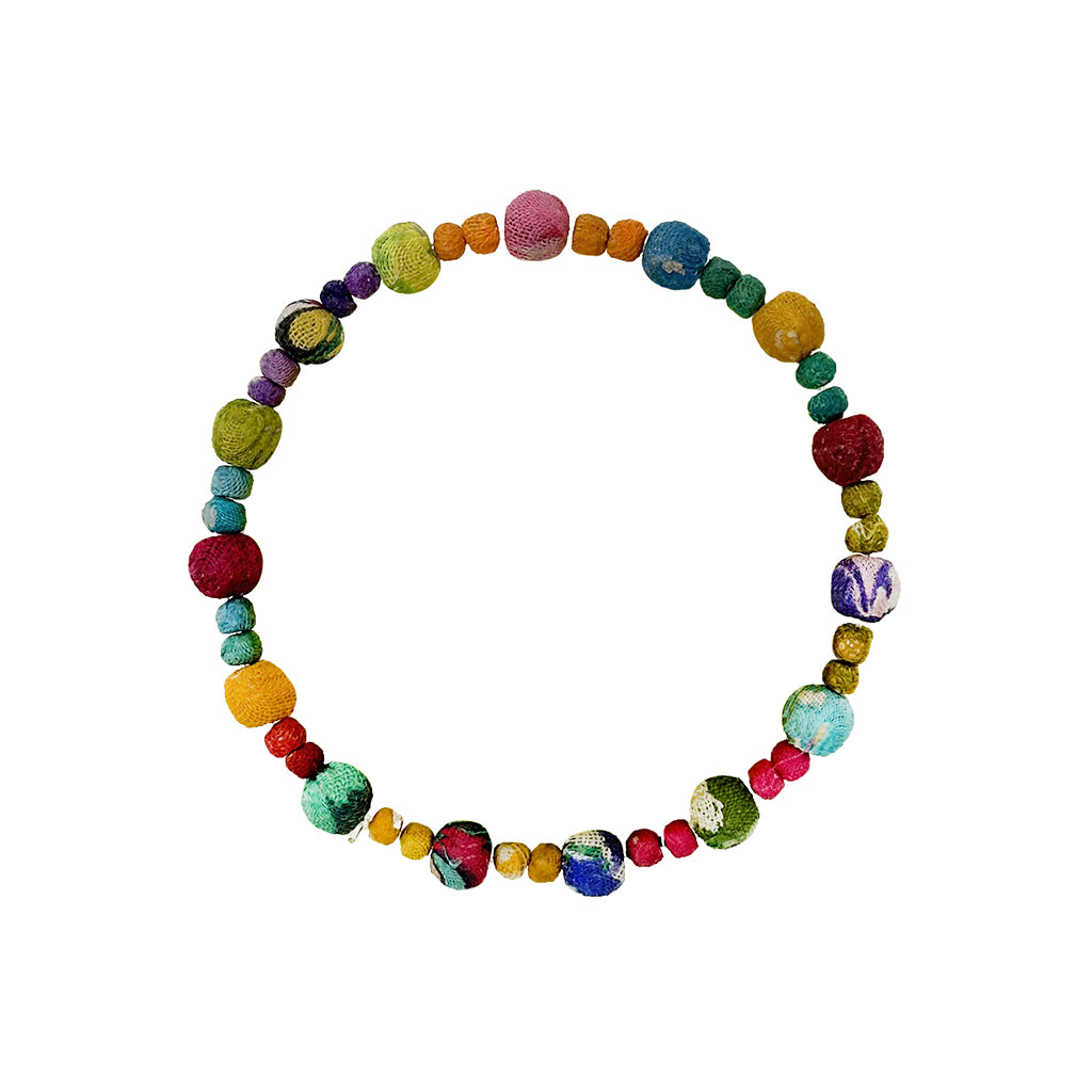 Multicoloured kantha fabric beaded bracelet on a white background
