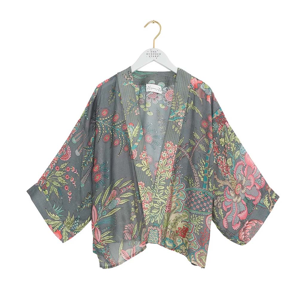 Floral patterned kimono style lightweight jacket on a hanger against a white background