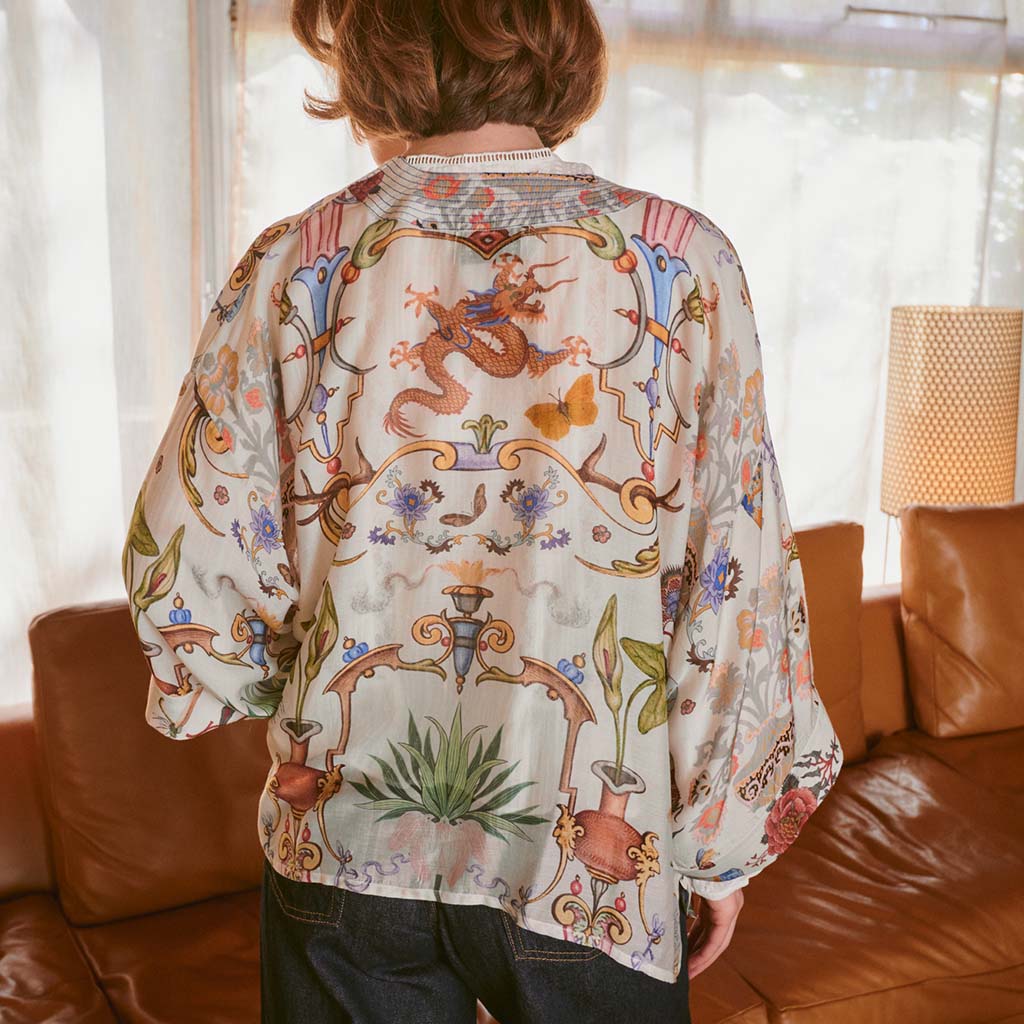 Model wearing Cornucopia Kimono in front of window and sofa showing back of the jacket