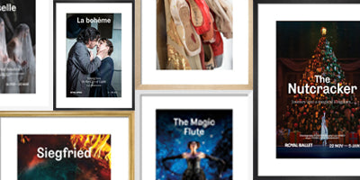 A collage of framed prints arranged in a grid, including titles such as The Nutcracker, The Magic Flute, and Siegfried. The frames are light wood, and the posters feature various colorful artwork styles.