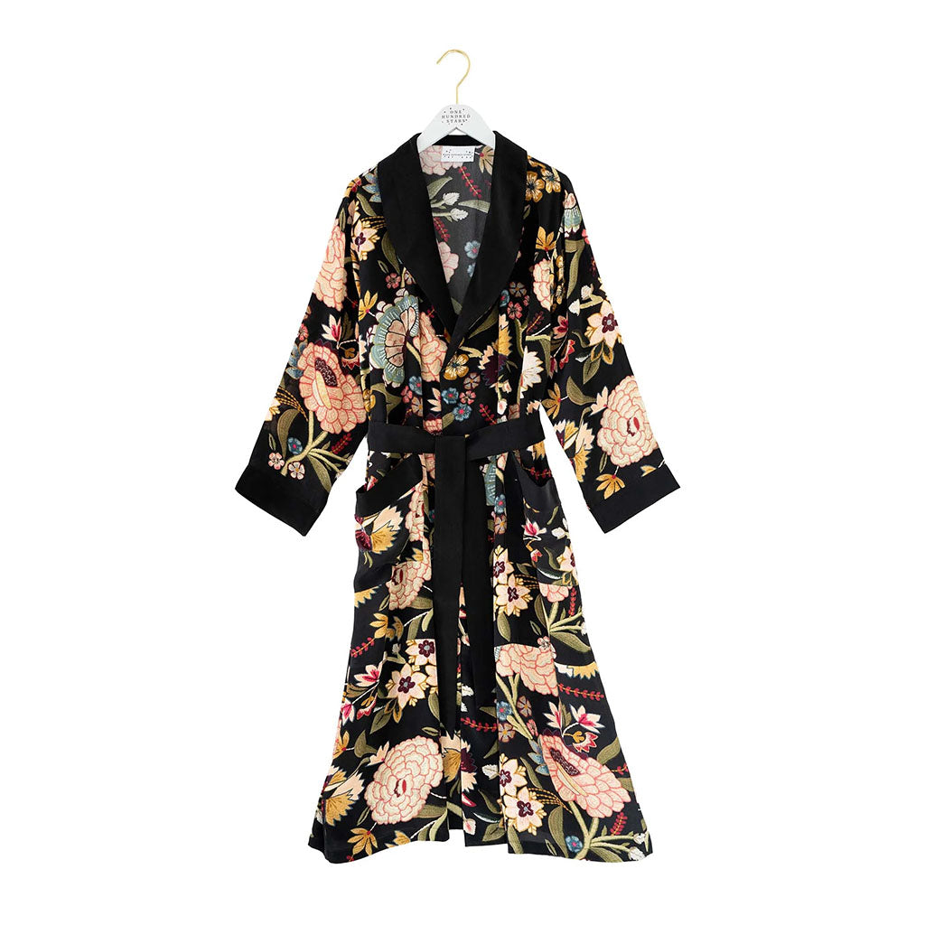 Floral Dahlia patterned robe / gown on a hanger against a white background