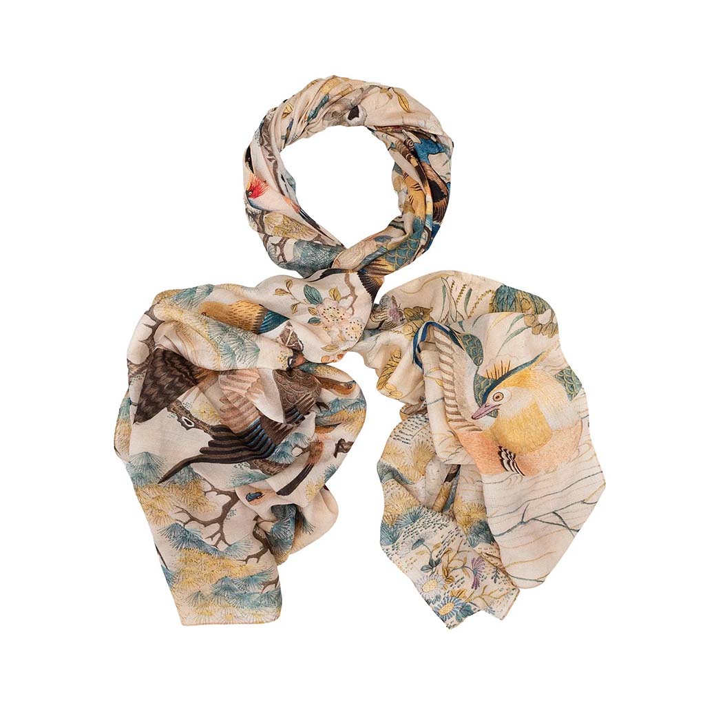 cream scarf with birds and nature design on a white background