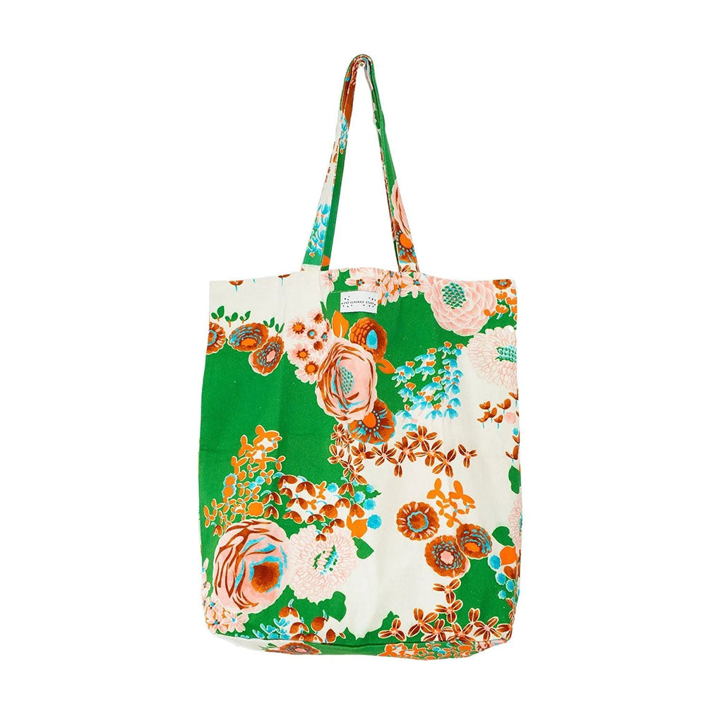 Floral tote bag with orange and green design on a white background