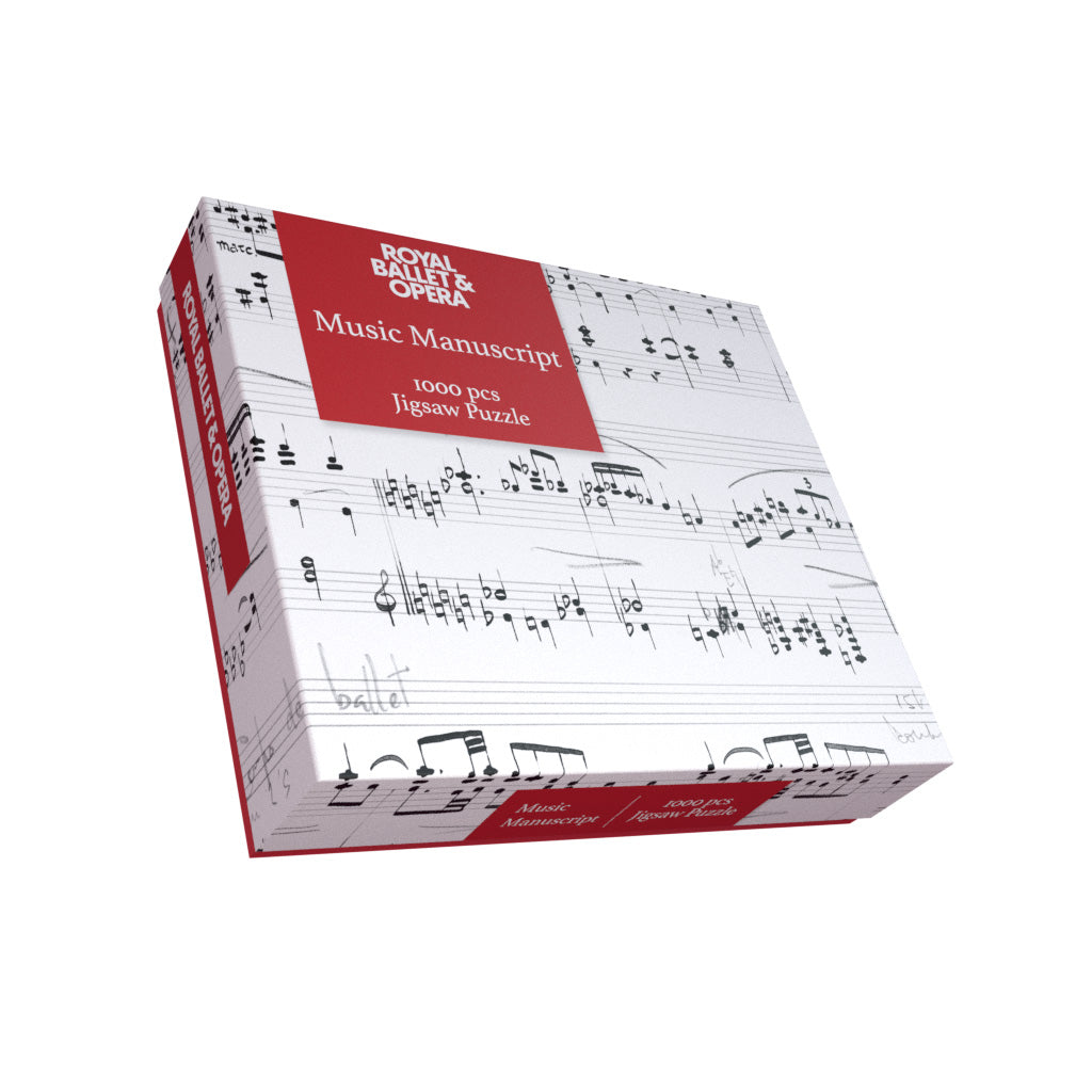 A boxed jigsaw puzzle package labeled 'Royal Ballet &amp; Opera Music Manuscript 1000 pcs Jigsaw Puzzle' with a white cover printed in black musical notation and red title panels, shown on a plain white background.