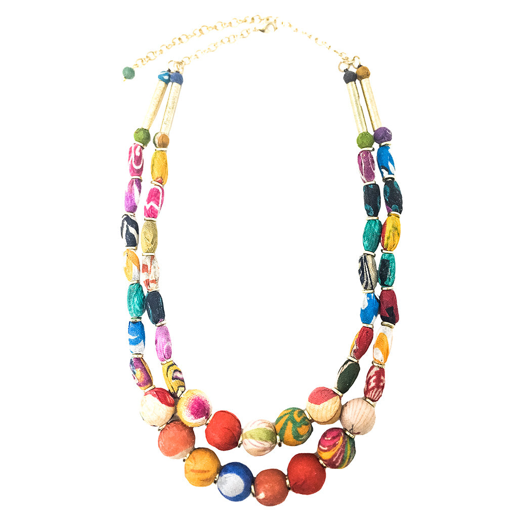 Colourful kantha fabric wrapped beaded necklace on a white background