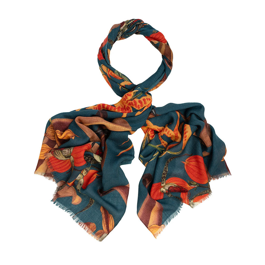 teal blue and orange wool scarf on a white background