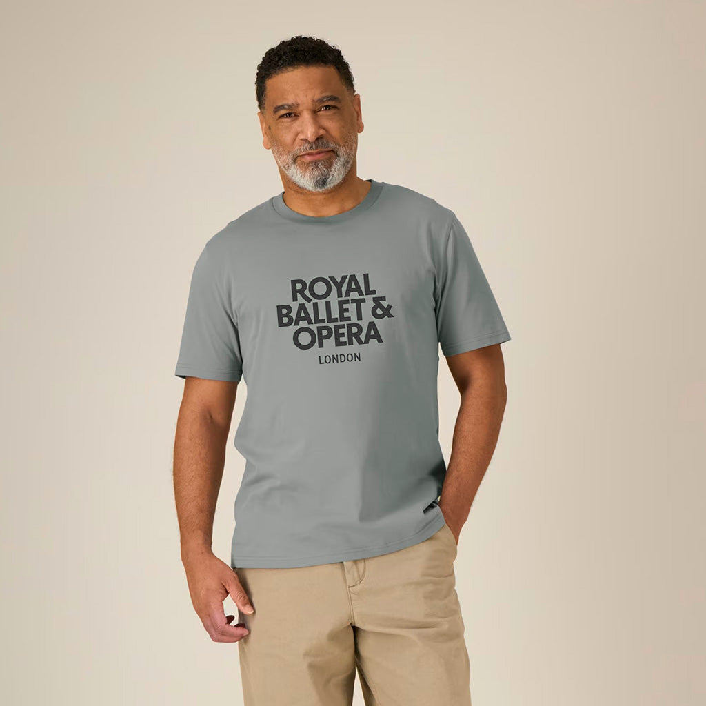 male model wearing a grey t-shirt with black text 'Royal Ballet &amp; Opera London' 
