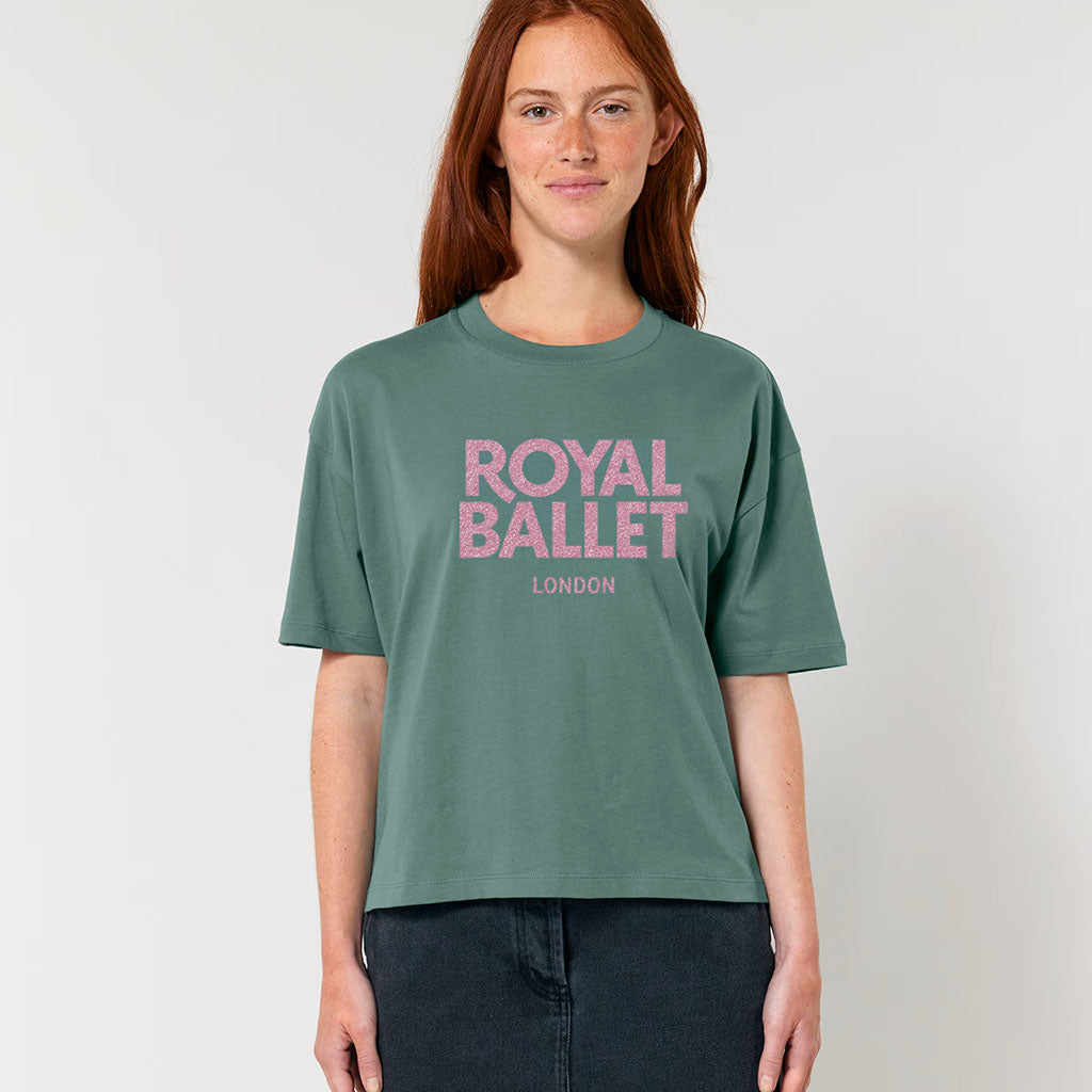 Person wearing a green 'Royal Ballet London' t-shirt on a plain background