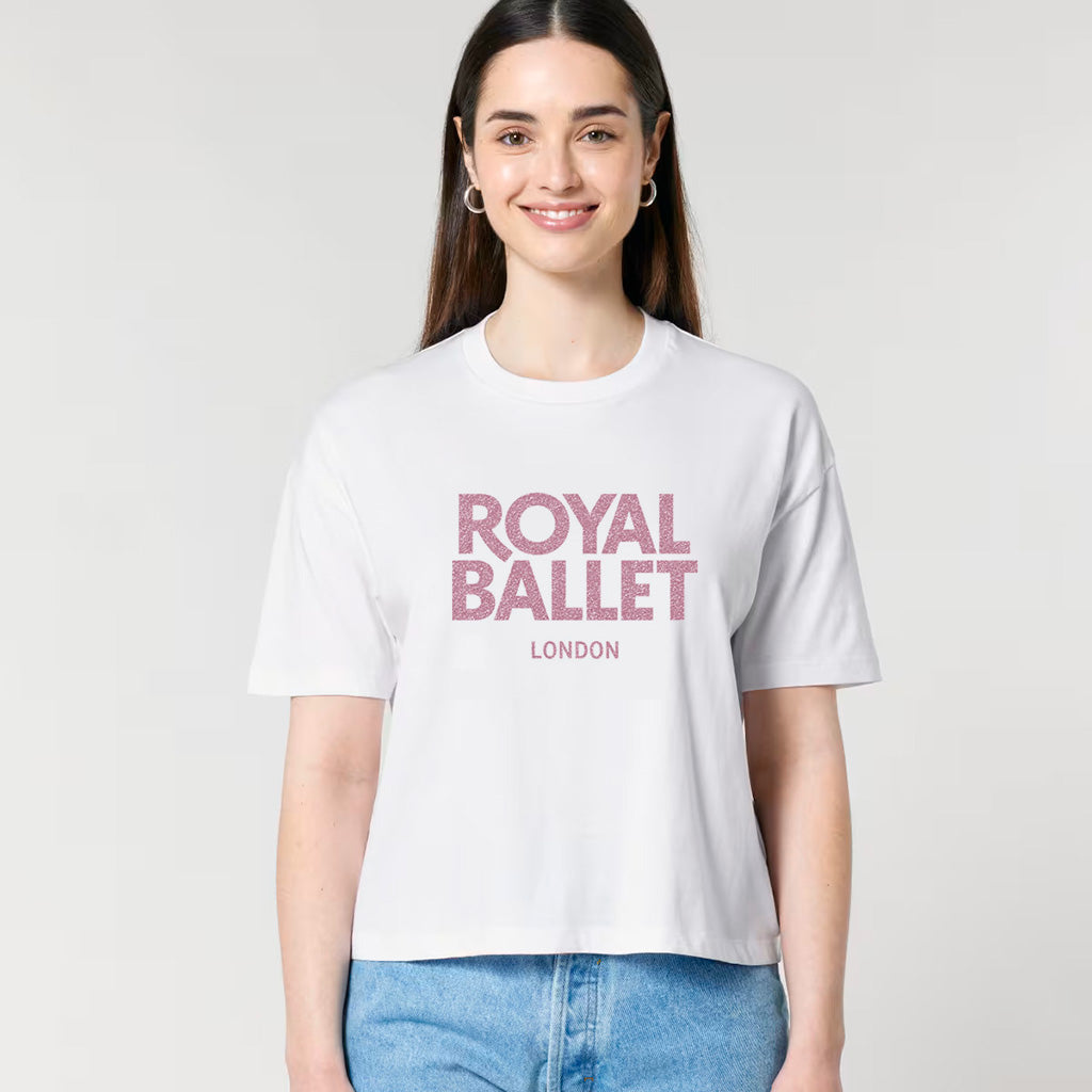Person wearing a white t-shirt with 'Royal Ballet London' text on a light grey background
