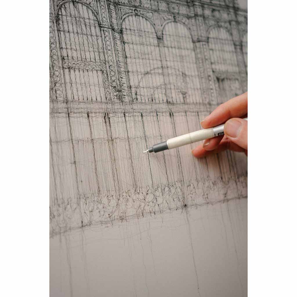 Close up of Luke Adam Hawker drawing on Bow Street