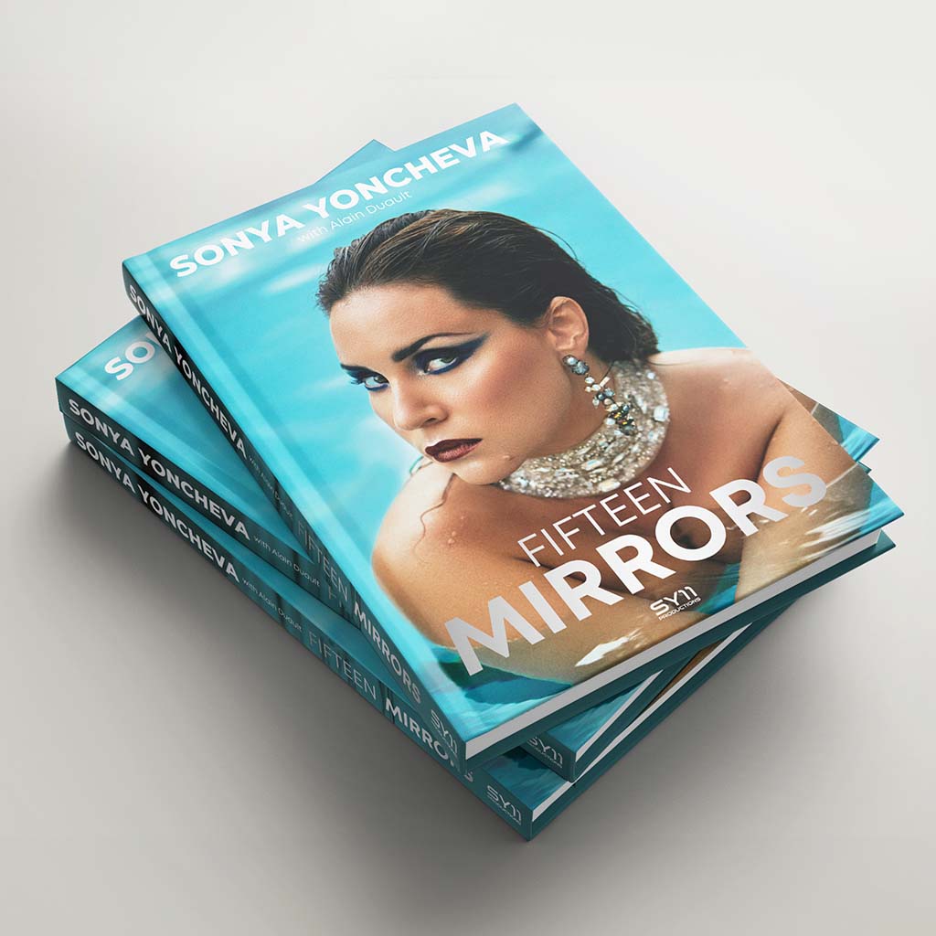 Three Fifteen mirrors Book in a pile on a grey background