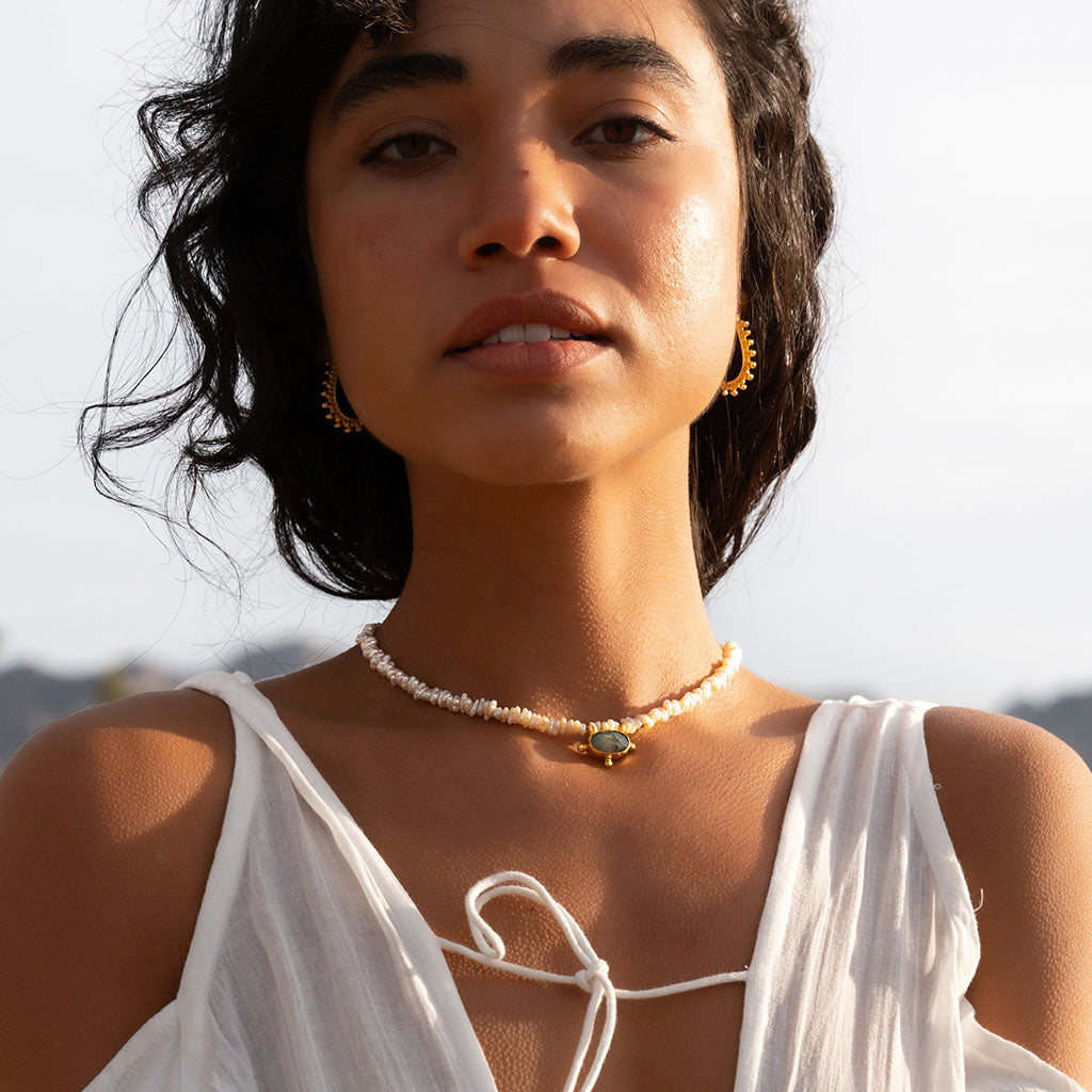 Pearl and Ladradorite Necklace on a model in the sun