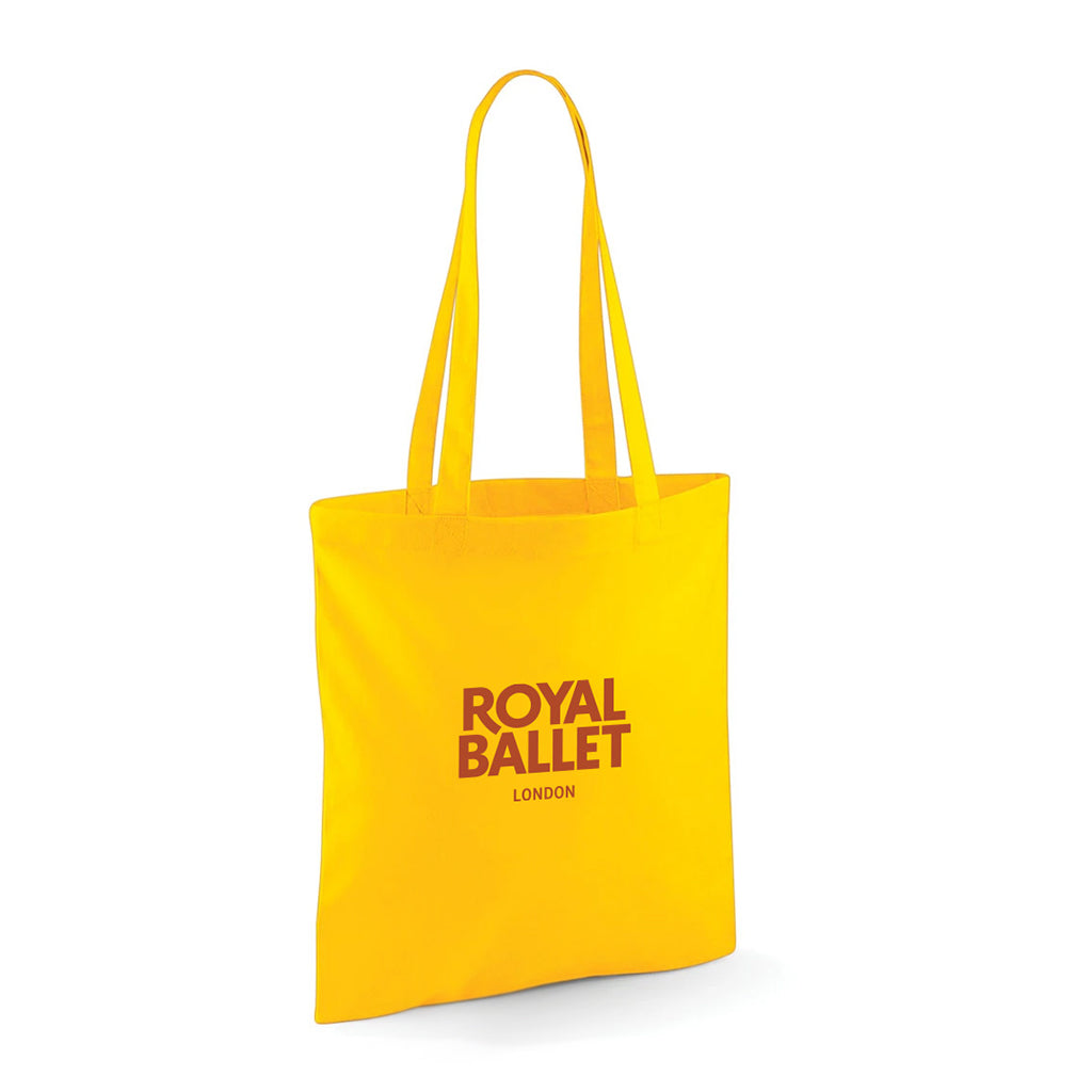 Yellow tote bag with 'Royal Ballet London' text on a white background