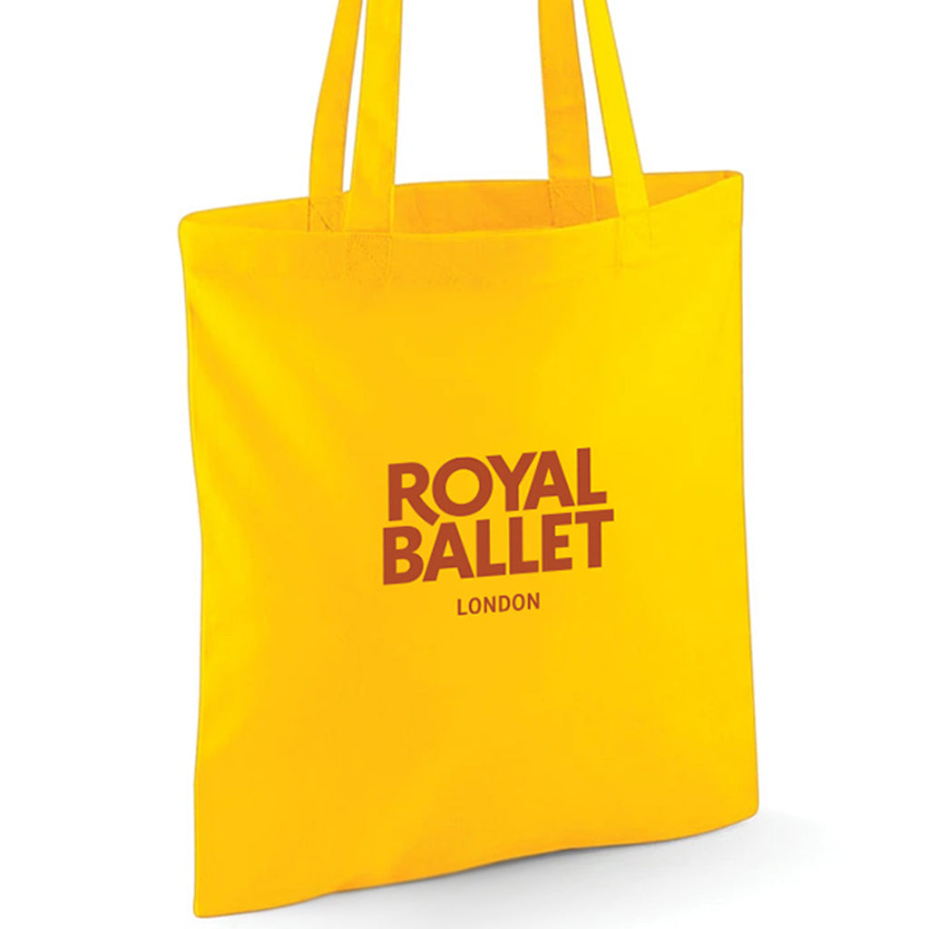 Yellow tote bag with 'Royal Ballet London' text on a white background