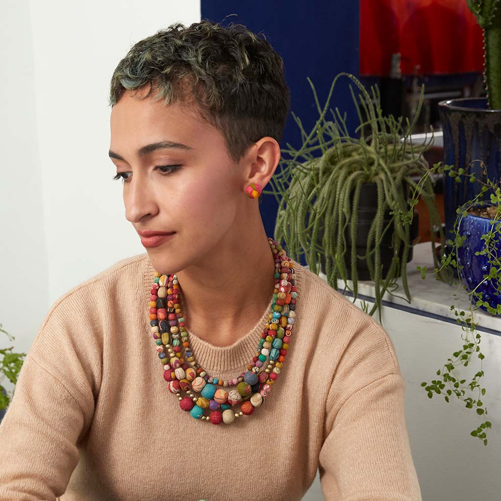 Kantha Aura Necklace on a model with plants