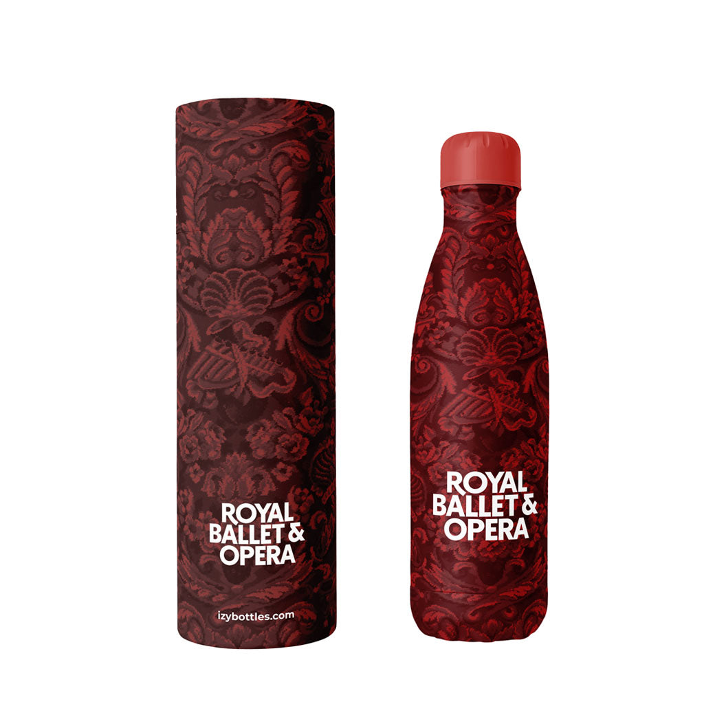 Red carpet patterned bottle and box with &#39;Royal Ballet &amp; Opera&#39; text on a white background