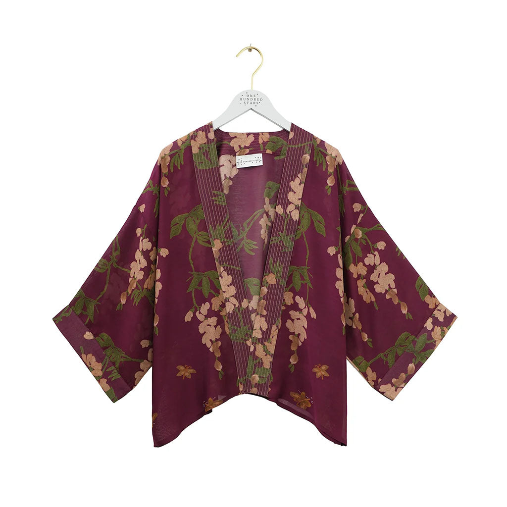 a plum coloured kimono style jacket with a wisteria design from One Hundred Stars