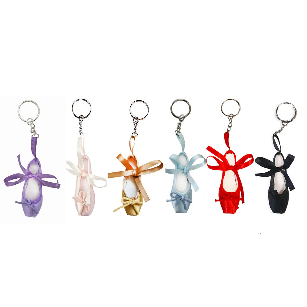 selection of colourful ballet shoe keyrings on a white background