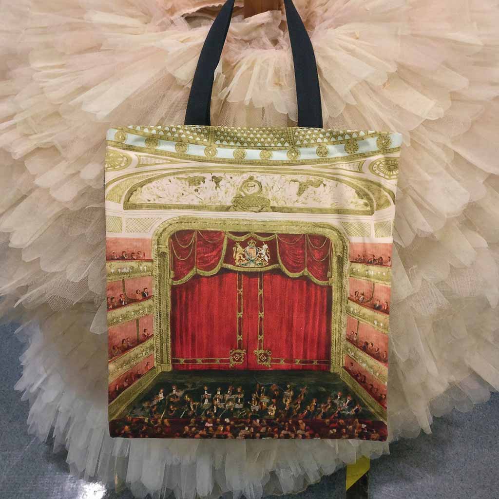 Night at the Opera House Tote Bag on front of a tutu tree back stage