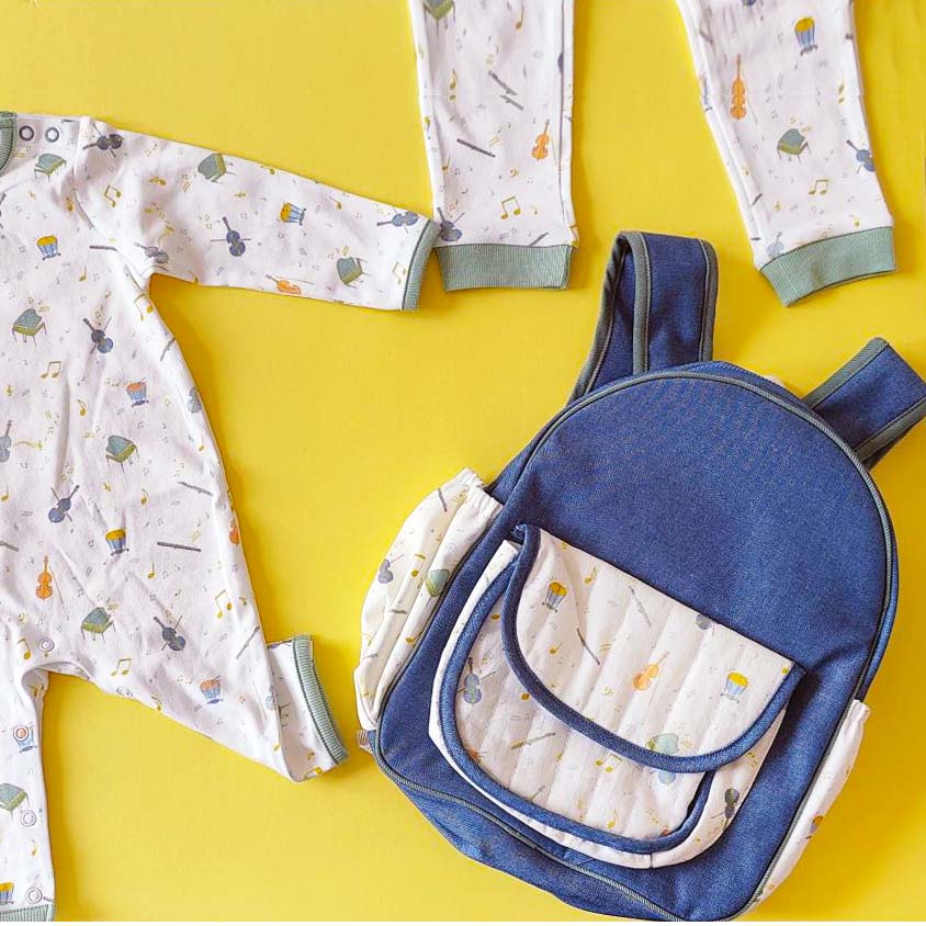 Orchestra Backpack on yellow background with kids orchestra pjs