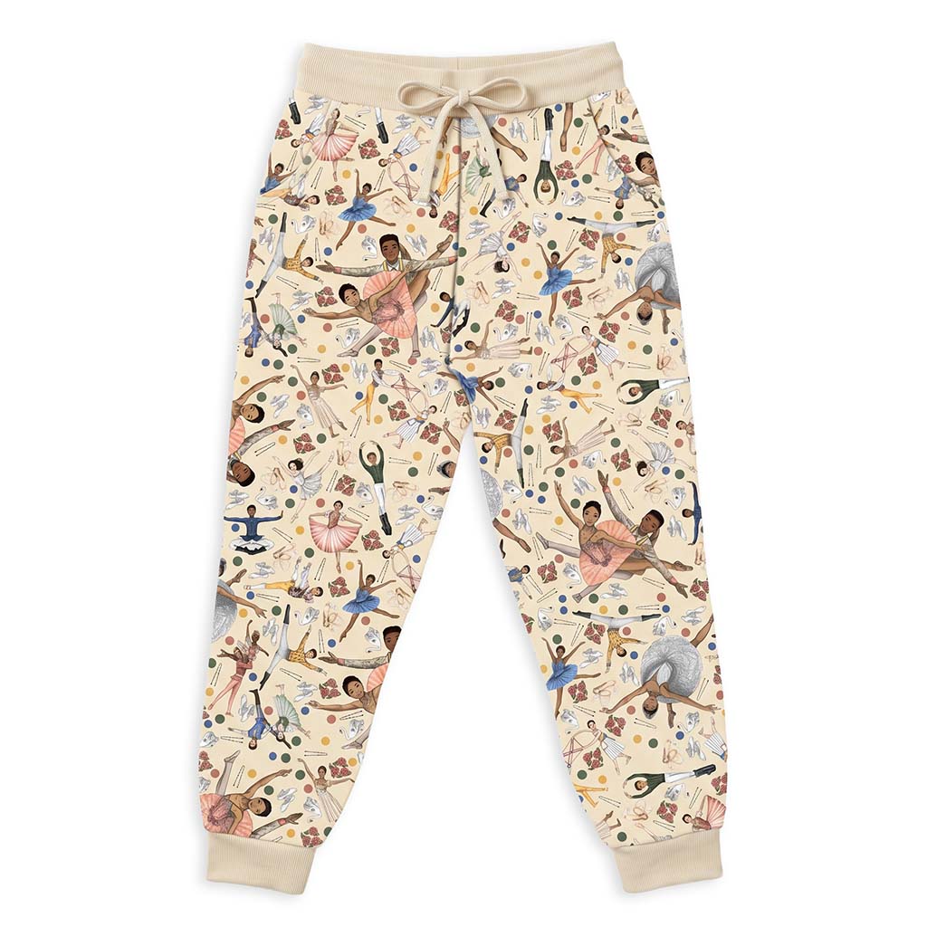 A pair of beige pj pants featuring an all-over print of ballet dancers in pink, blue, and brown, with a matching beige drawstring waist and ribbed cuffs.