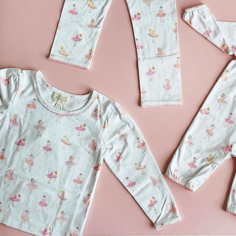 flat lay of Ballet Dancer Jersey Pyjama on pink background