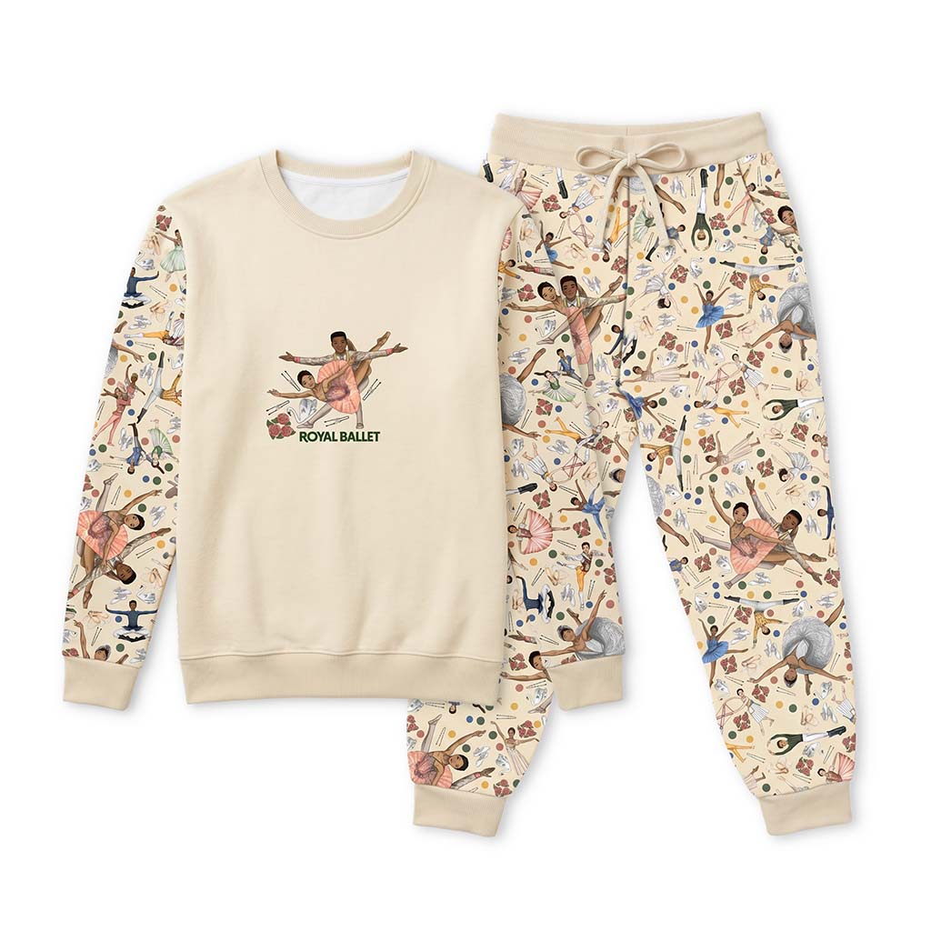 A matching two-piece pj set featuring a cream sweatshirt with a 'Royal Ballet' graphic on the chest and patterned sleeves, paired with matching joggers covered in a ballet dancer collage print, shown on a white background.
