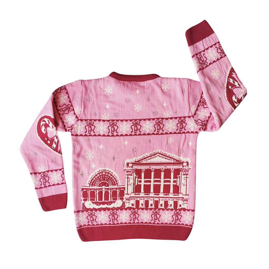 Back view of the pink Barbie Royal Ballet Christmas Jumper with a dark pink graphic of the Royal Opera House, featuring  snowflakes and ballet shoes pattern