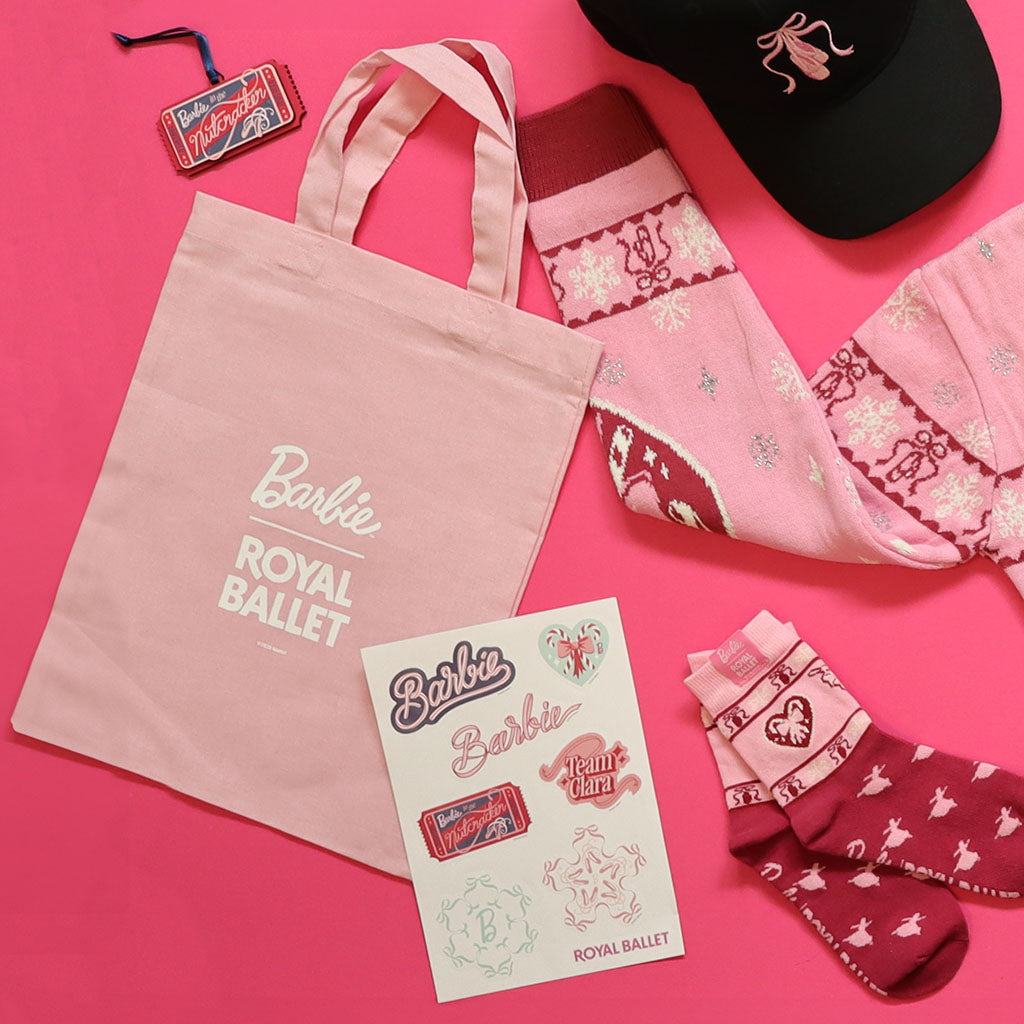 A mini pink cotton tote bag with white printed text reading 'Barbie ROYAL BALLET' and a small '©2025 Mattel' line at the bottom, shown on a plain white background.