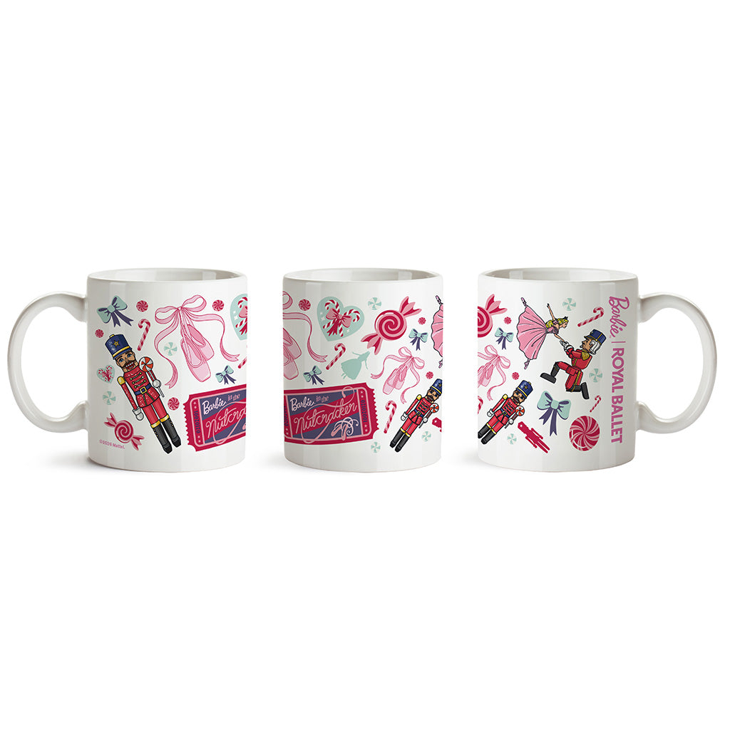 Three views of a ceramic mug shown side by side on a white background, each printed with a colourful Christmas nutcracker and candy-themed pattern including pink bows, lollipops, candy canes, and a red-and-black nutcracker figure.