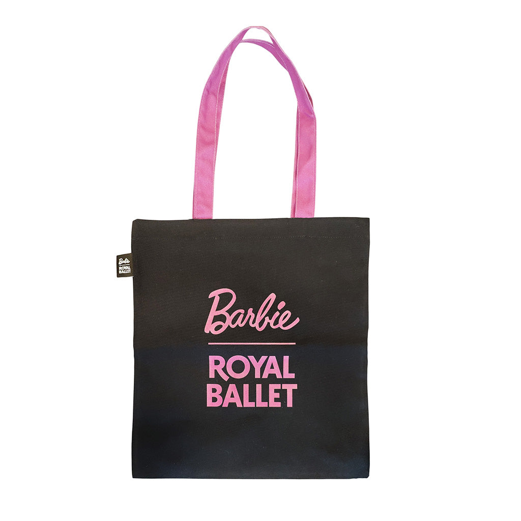 black tote with pink handles with pink text Barbie Royal Ballet on a white background