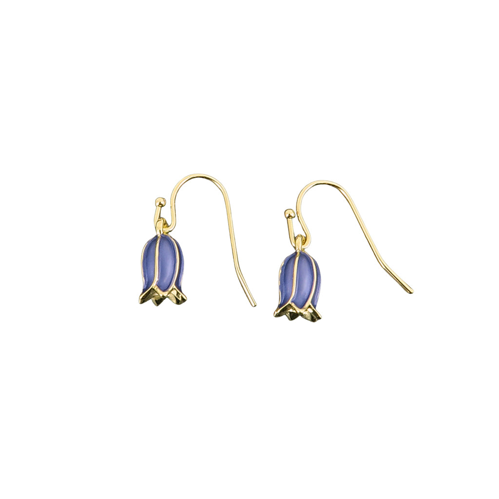 Gold earrings with bluebell flower-shaped charms on a white background
