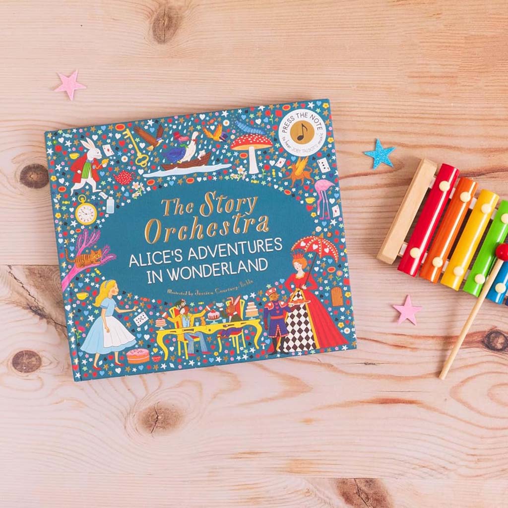 The Story Orchestra: Alice's Adventures in Wonderland board book, featuring a colourful illustrated design cover and xylophone on a wooden surface