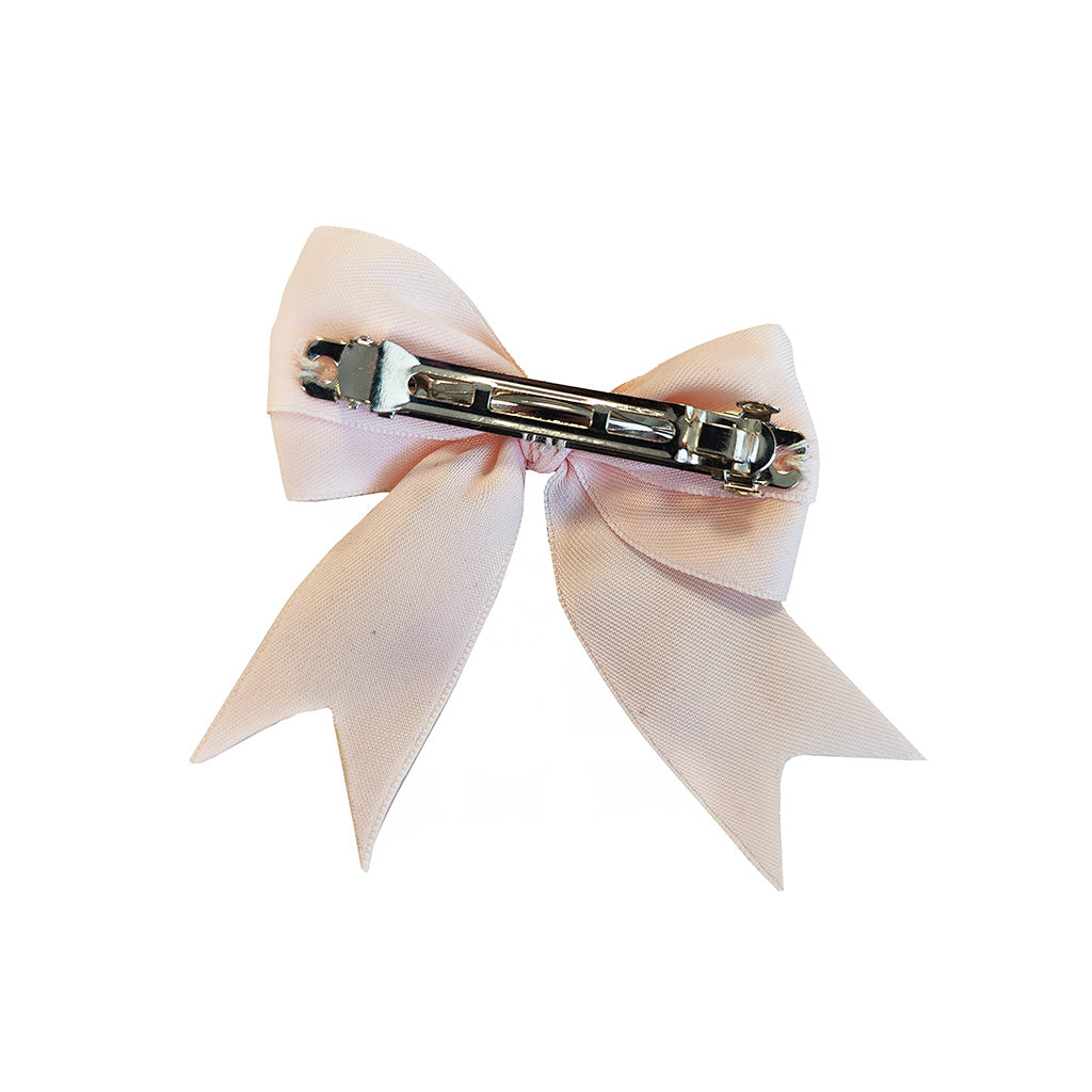 A light pink satin hair bow clip with a silver metal spring clasp, shown against a plain white background.