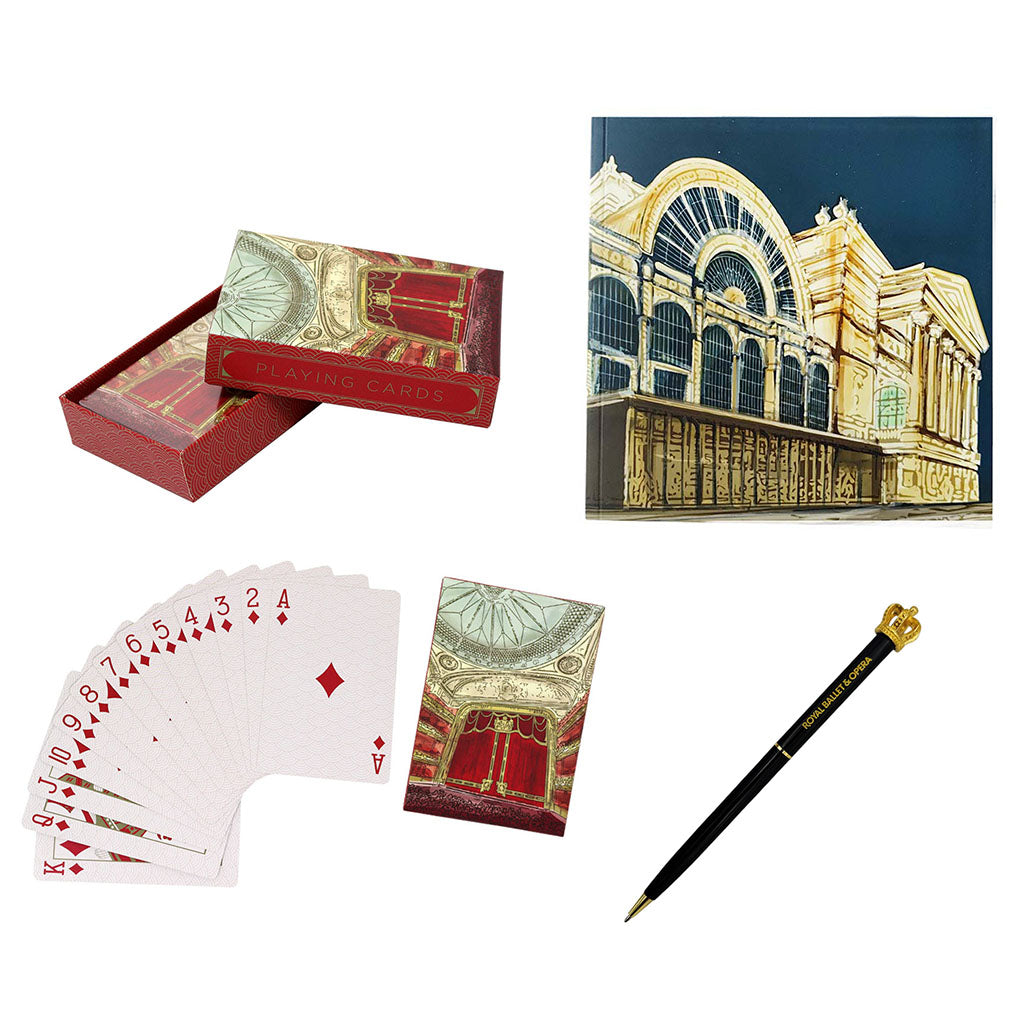 Two pack of playing cards with a decorative notebook and crown pen on a white background