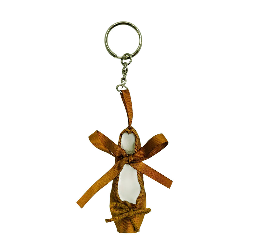 Bronze ballet shoe keyring with a ribbon on a white background