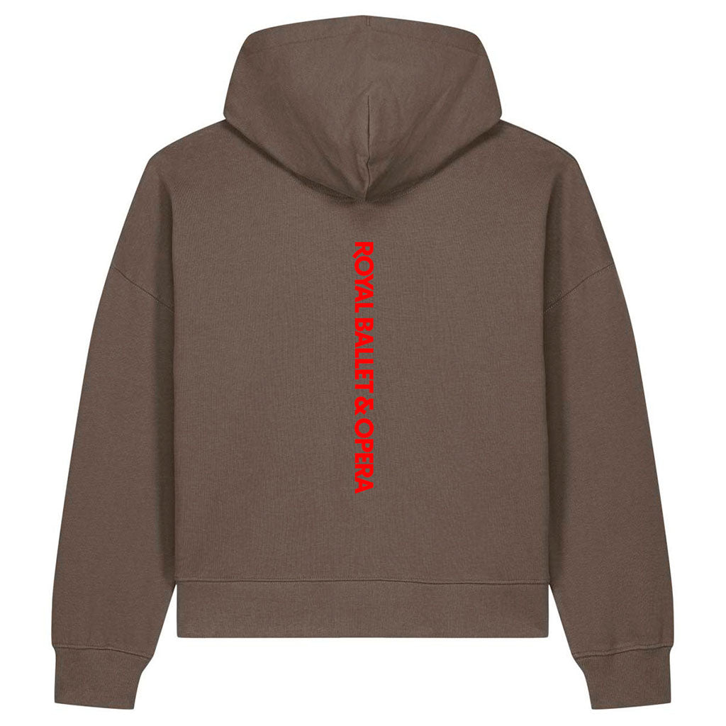 A brown slightly cropped hoodie shown from the back, featuring a vertical red graphic print that reads 'ROYAL BALLET &amp; OPERA' on the centre back.