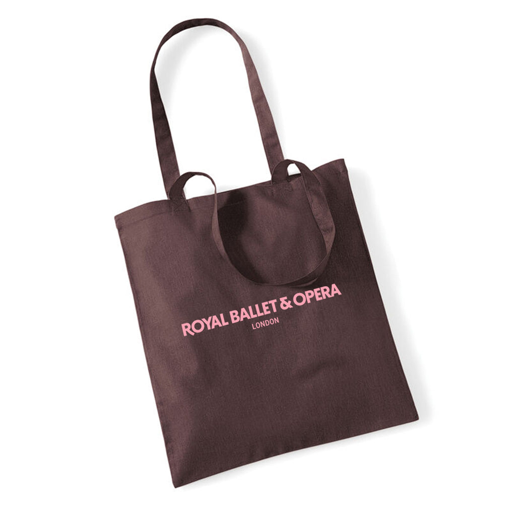 Brown tote bag with &#39;Royal Ballet &amp; Opera London&#39; in pink text on a white background