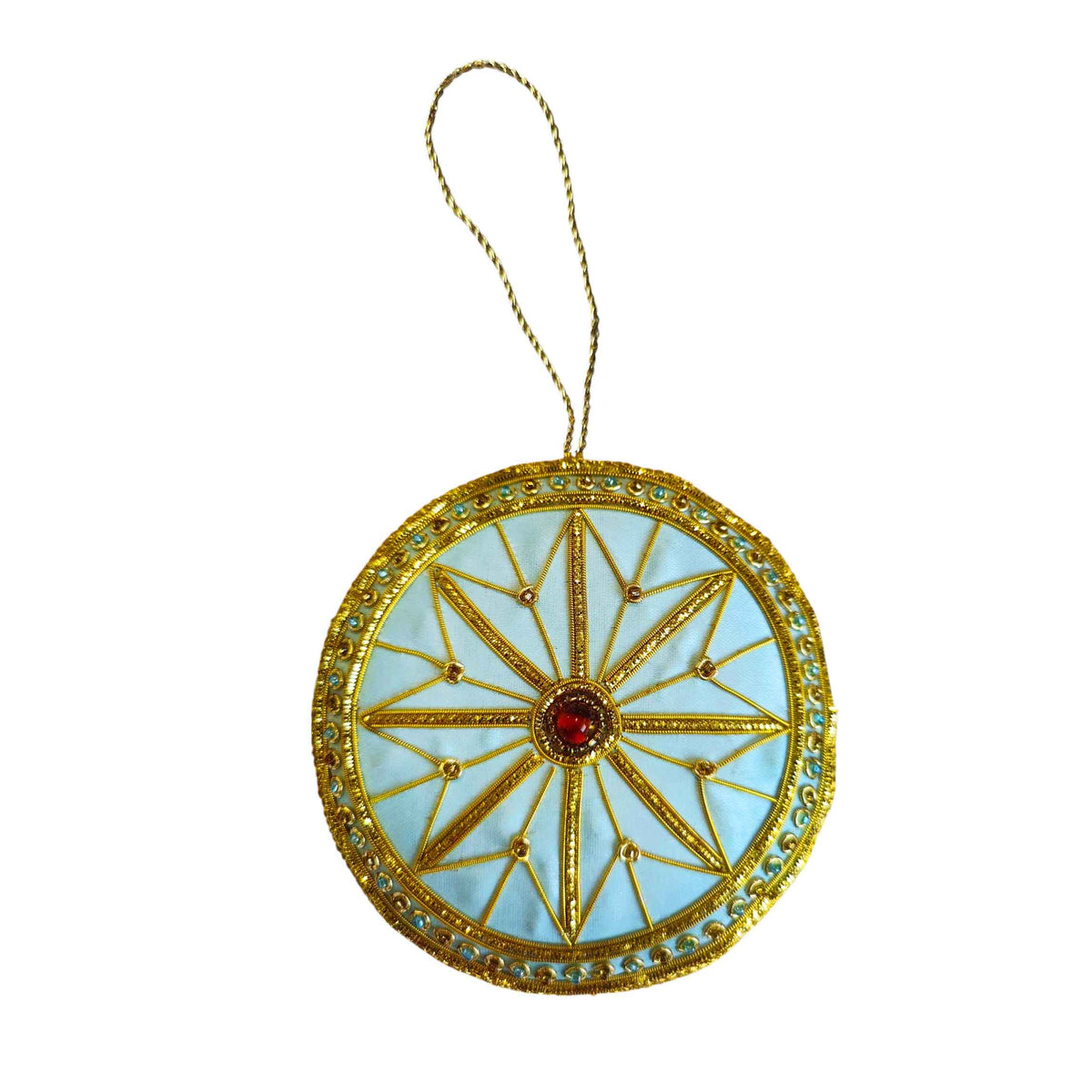 Decorative circular decoration inspired by the auditorium ceiling  at the RBO with gold  and blue detailing and a red gemstone on a white background