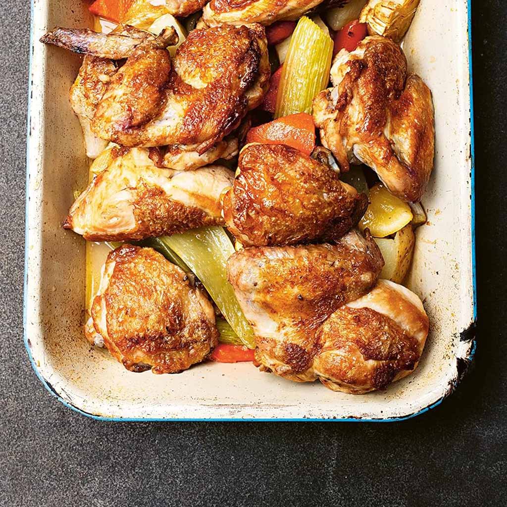 Book cover of 'The Weekend Cook' by Angela Hartnett with a teal background and photo of a chef in a kitchen.