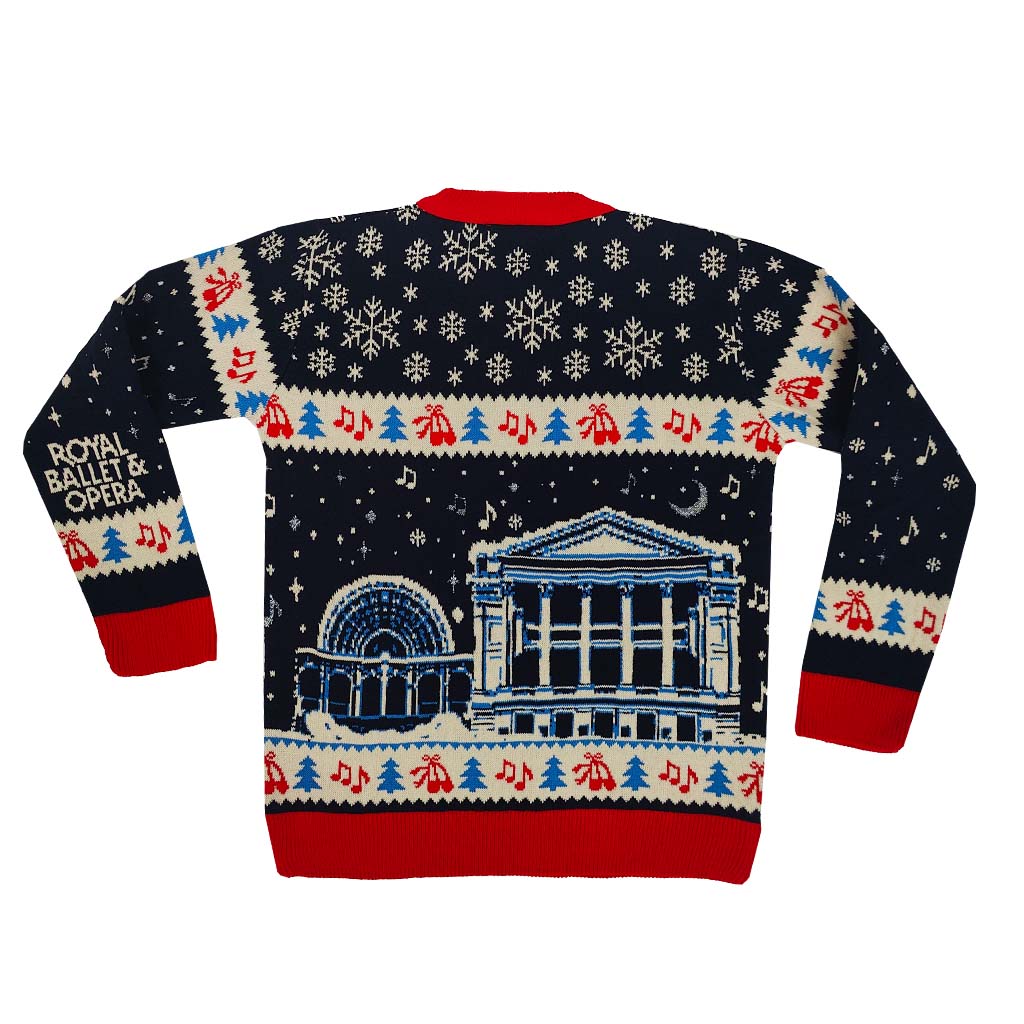 Back view of the Royal Ballet and Opera Christmas Jumper featuring the Royal Opera House with snowflakes, music, trees and ballet shoe knit detail on a white background