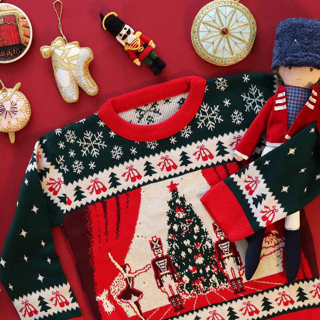 Christmas-themed RBO jumper sweater with festive ballet patterns on a red background