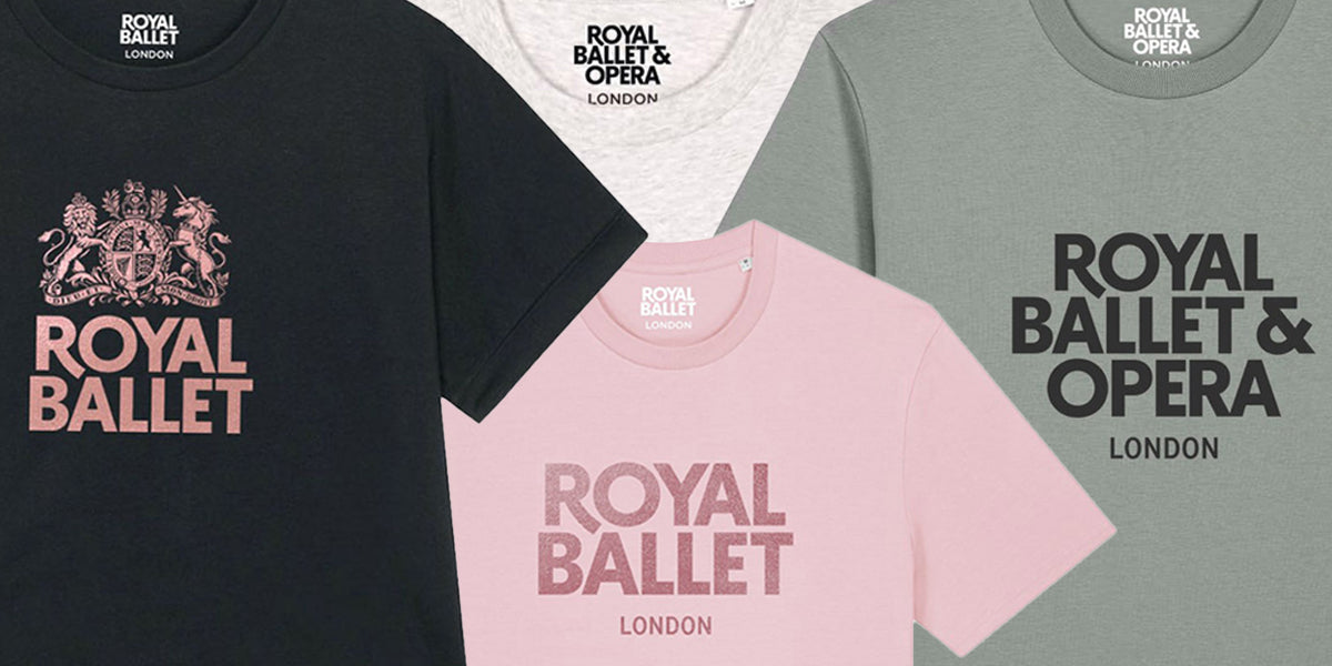 Four short-sleeve T-shirts arranged in a fan layout, two have printed Royal Ballet & Opera London logos and two have Royal Ballet London logos. The shirts are shown in black, grey and light pink, with varying logo styles and crest graphics.