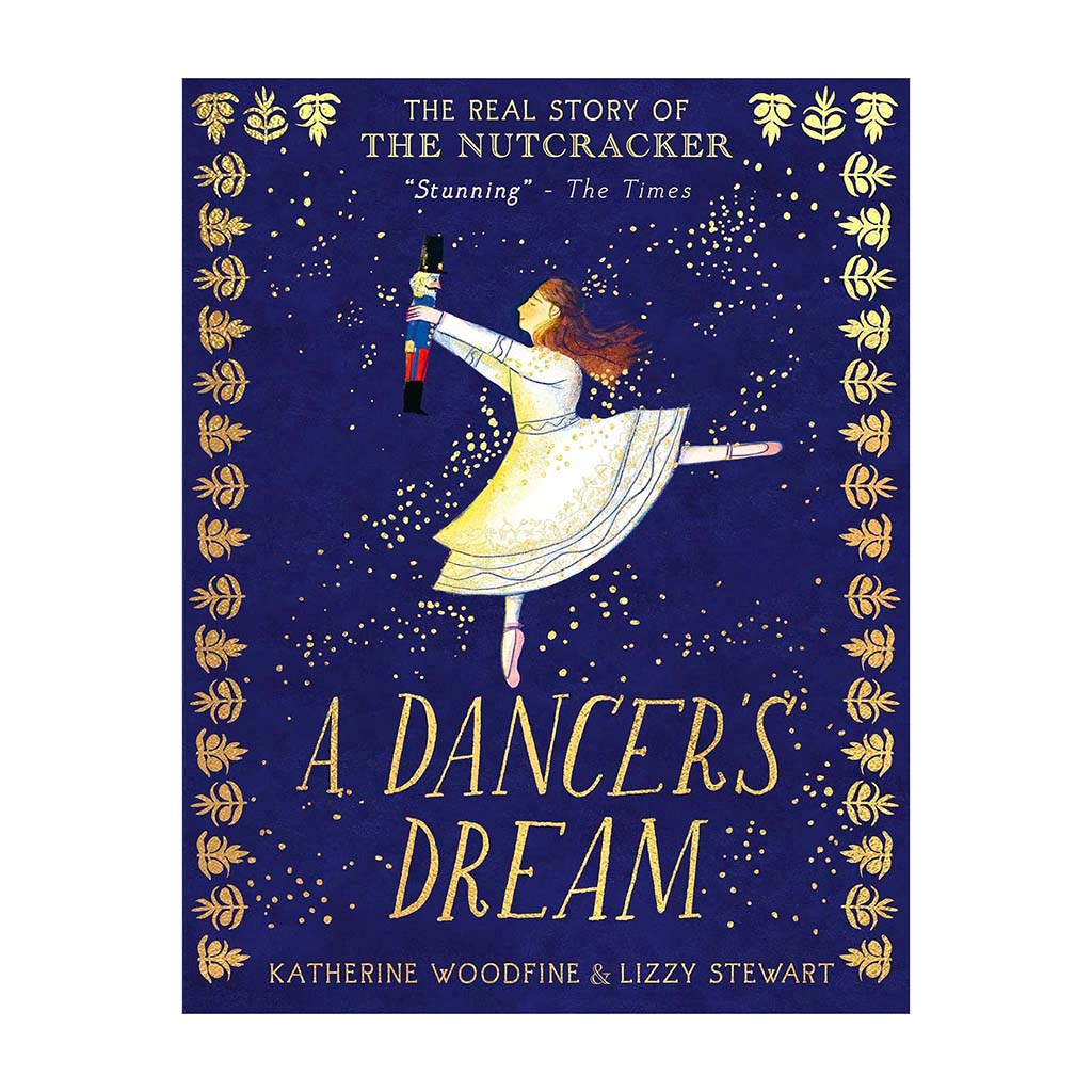 front book cover in blue and gold with Clara holding a Nutcracker, text A Dancer's Dream on a white background