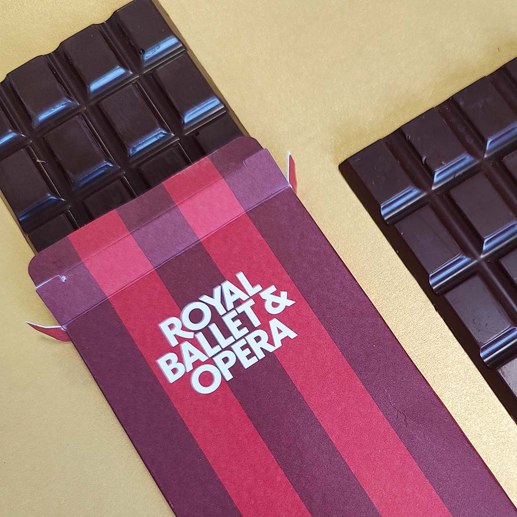 Chocolate bar with &#39;Royal Ballet &amp; Opera&#39; packaging on a gold background